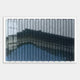 The Tessera Frosted & Midnight Blue Gradient Acrylic 3D Wall Art by Giant Sculptures showcases small, overlapping chevrons in gray, blue, and black, forming a striking wave-like gradient—perfect for fans of Gradient Wall Art.