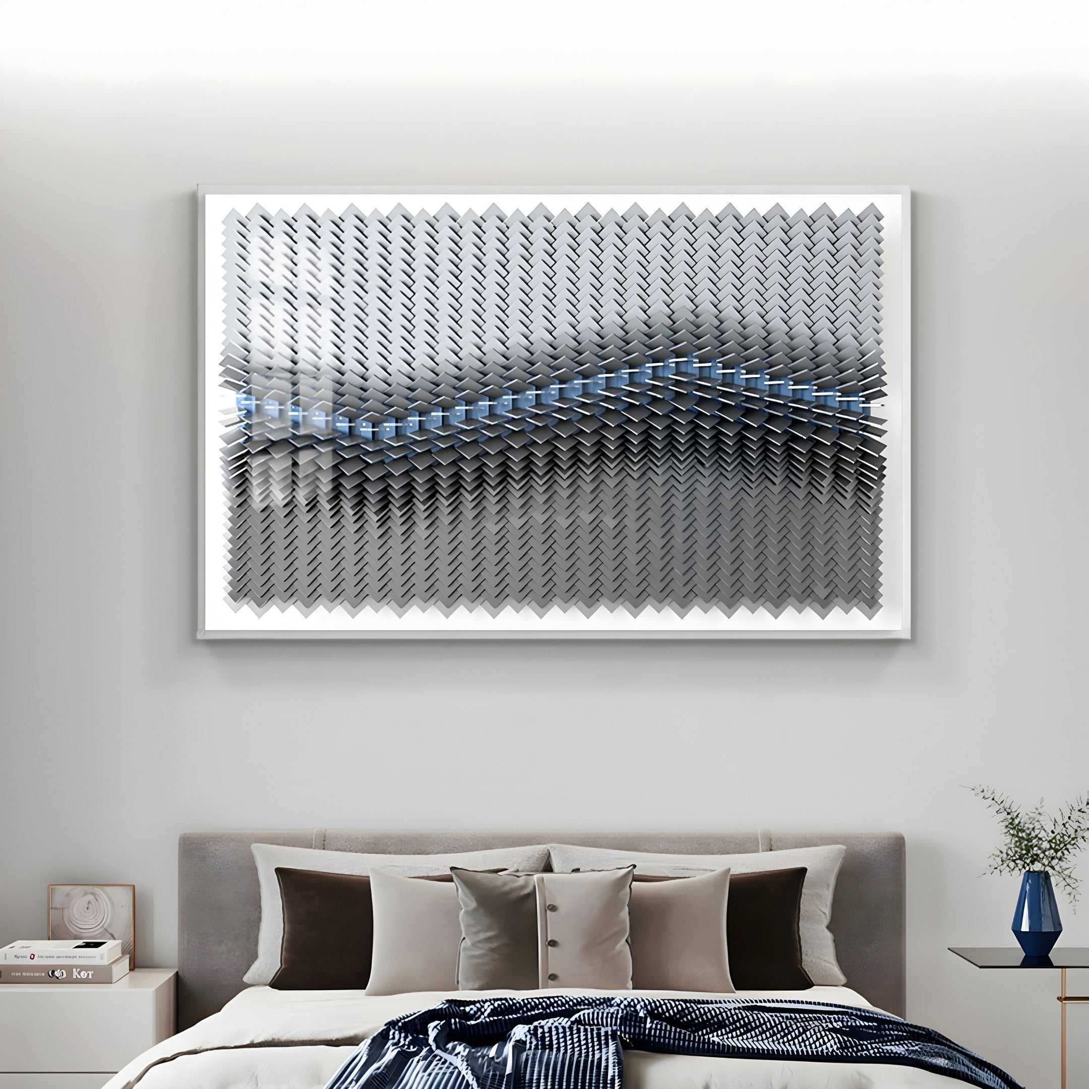 A modern bedroom features a grey upholstered bed, beige and brown accent pillows, a draped blanket, and the Tessera Silver Mist & Pastel Blue Line Acrylic 3D Wall Art by Giant Sculptures with metallic wavy blue accents above the headboard.