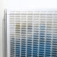 The Giant Sculptures Chromat Nebula Blue Gradient Acrylic 3D Wall Art features a grid of color blocks fading from neutral tones to blues, creating a bold contemporary statement piece for your wall decor.