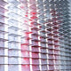 The Chromat Orchid Blush Fade Acrylic 3D Wall Art by Giant Sculptures features overlapping translucent panels in white and pink, lit from behind to create glowing horizontal gradients—an ideal piece of contemporary wall decor.