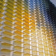 The Chromat Lemon Sky Radiance Acrylic 3D Wall Art by Giant Sculptures features yellow and blue rectangular panels, creating a geometric gradient from warm yellow at the bottom left to cool blue at the top right.
