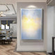 The Chromat Lemon Sky Radiance Acrylic 3D Wall Art by Giant Sculptures adds modern flair with vertical slats and a blue-yellow gradient, making a striking centerpiece in a stylish dining room with patterned chairs and wood flooring.