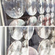 Close-up of Giant Sculptures Reflect Misty Rose & Storm Blue Mirror Acrylic 3D Wall Art, showcasing large convex mirrors in a grid on a transparent panel, creating striking reflections and modern geometric decor.