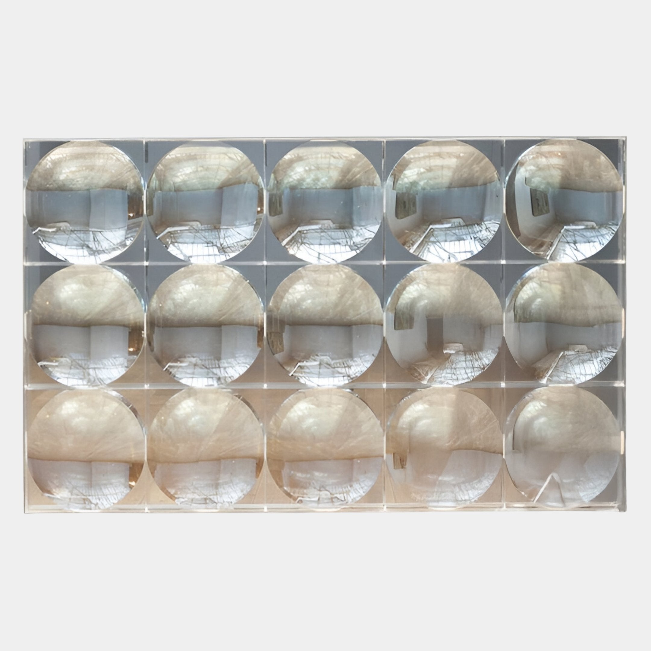 Reflect Champagne Beige & Soft Silver Mirror Acrylic 3D Wall Art by Giant Sculptures features a grid of 16 convex acrylic mirrors on a panel, creating sculptural wall art with unique, repeated reflections in any bright room.