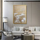 A modern Zen living room features a light grey sofa, round coffee table, and armchair. Decorative pillows complement the Dynasty Golden Cliffs Framed Acrylic 3D Wall Art by Giant Sculptures above the sofa, adding depth to the space.