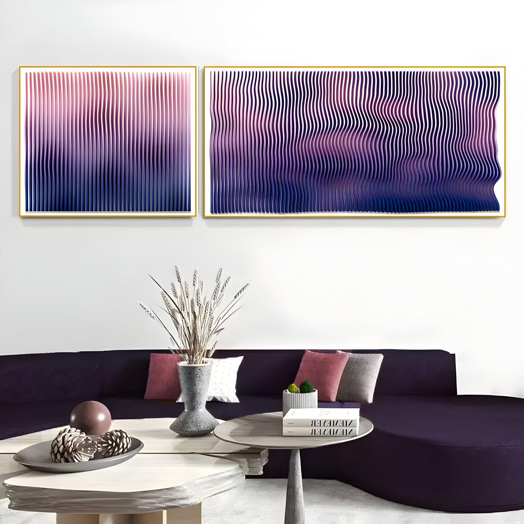 A modern living room featuring a dark purple sofa, a round coffee table, and two Giant Sculptures Current III Rose Plum & Midnight Purple Acrylic 3D Wall Art pieces with abstract wavy lines in pink, purple, and blue above the sofa.