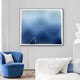 A modern living room with a white couch, blue velvet chair, gold floor lamp, and Giant Sculptures’ Current III Navy Sky & Icy White Acrylic 3D Wall Art featuring vertical blue and white wavy lines on the light gray wall.