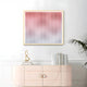 The Current III Blush Coral & Snow White Acrylic 3D Wall Art by Giant Sculptures hangs above a light pink cabinet, with a gold sculpture, small book, and plant on the right for a fresh, modern look.