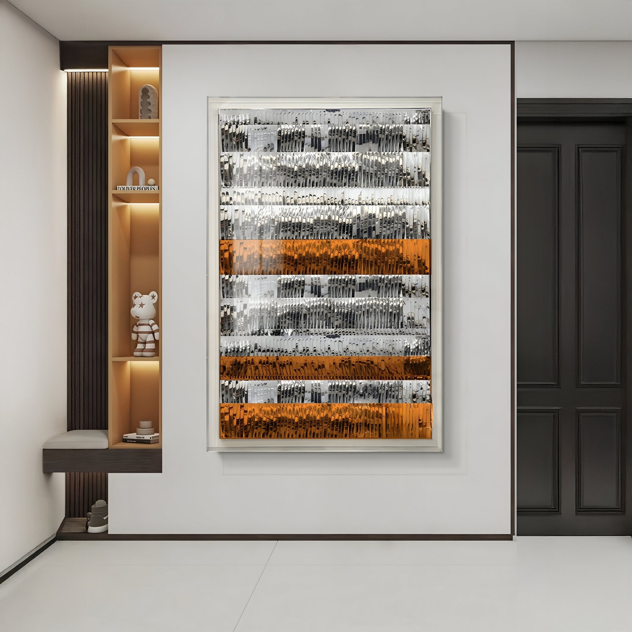 A modern hallway showcases the Giant Sculptures Rhythm Tangerine & Silver Layered Stripe Leather 3D Wall Art, featuring bold horizontal stripes. Decorative shelves sit left, a dark door right, creating a well-lit, minimalistic space.