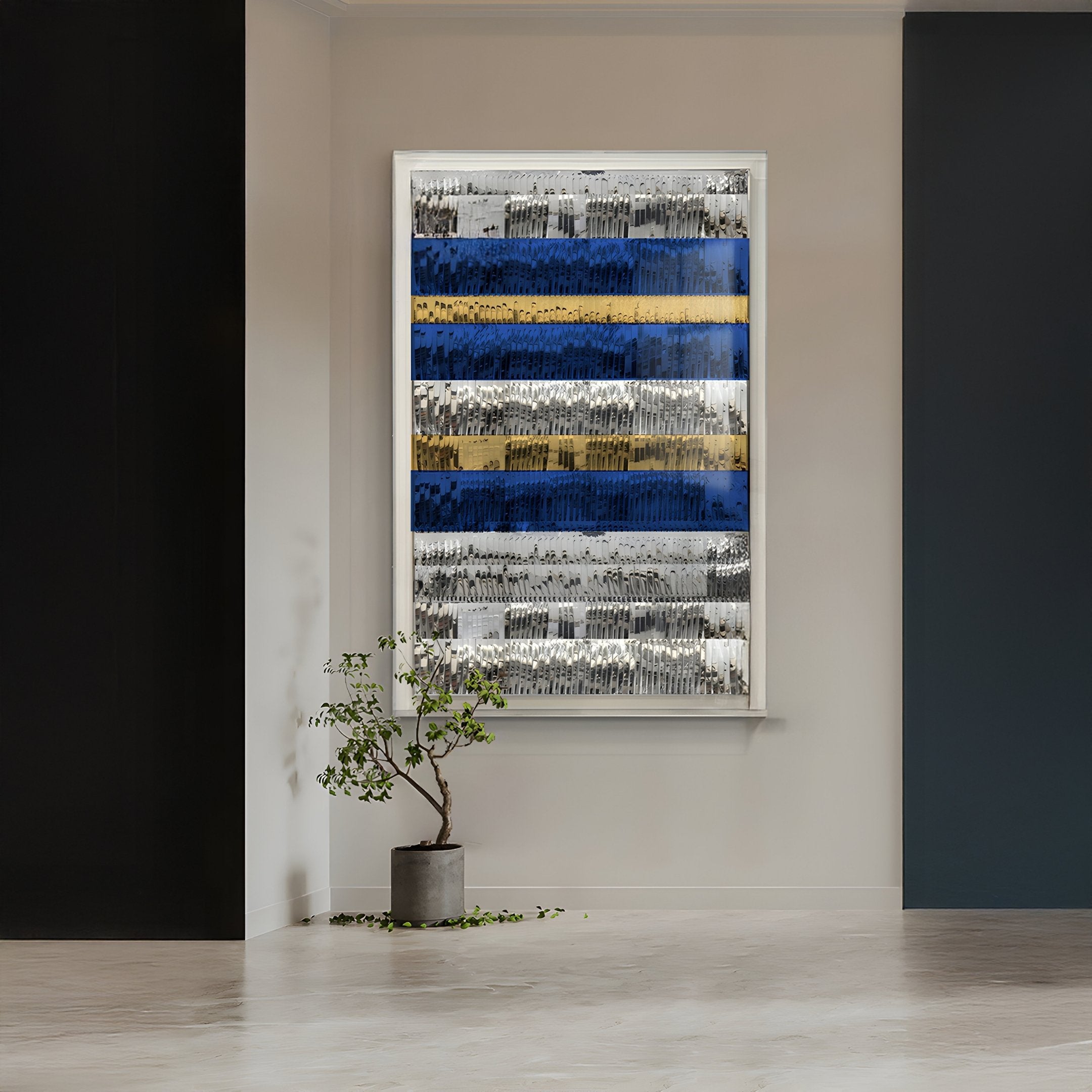 A potted plant rests on a light floor near a window with an abstract privacy covering of black, white, blue, and yellow stripes. The Rhythm Sapphire & Gold Layered Stripe Leather 3D Wall Art by Giant Sculptures adorns the white and dark navy walls.