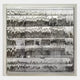 The Rhythm II Silver Layered Stripe Leather 3D Wall Art by Giant Sculptures showcases a wall-mounted display of shiny silver forks, knives, and spoons in neat rows, creating a reflective layered stripe effect.