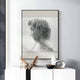 The Edge Greige David Bust Leather & Acrylic 3D Wall Art by Giant Sculptures hangs above a white cabinet decorated with vases and dried plants, complementing the neutral modern interior with its unique textured design.