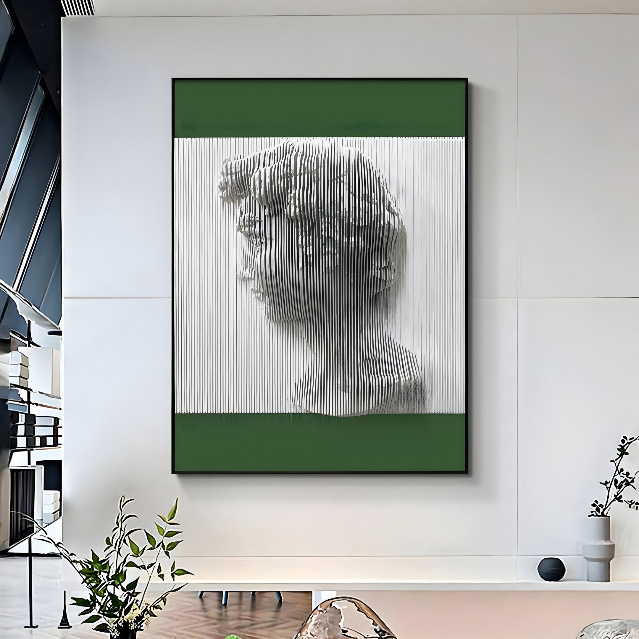 A modern living space showcases the Edge Forest Green David Bust Leather & Acrylic 3D Wall Art by Giant Sculptures, with a profile design in green and white. Minimalist decor and plants complete the fresh, modern Renaissance style.