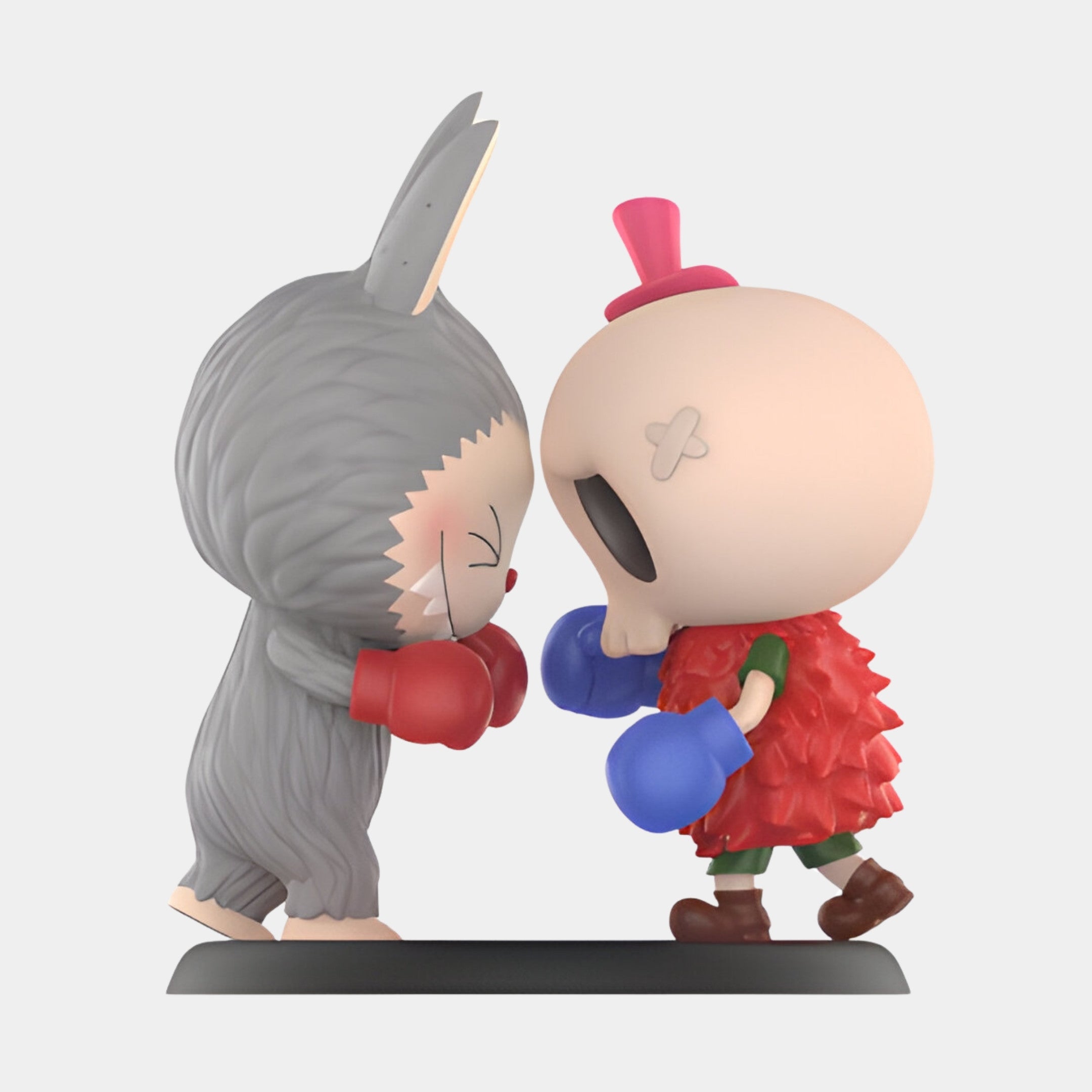 Two Spooky Buddies—one in a gray bunny suit with red gloves, the other in a red outfit with skull mask, pink hat, and blue gloves—face off forehead to forehead on a black base in this 100cm Labubu Sculpture from Giant Sculptures.