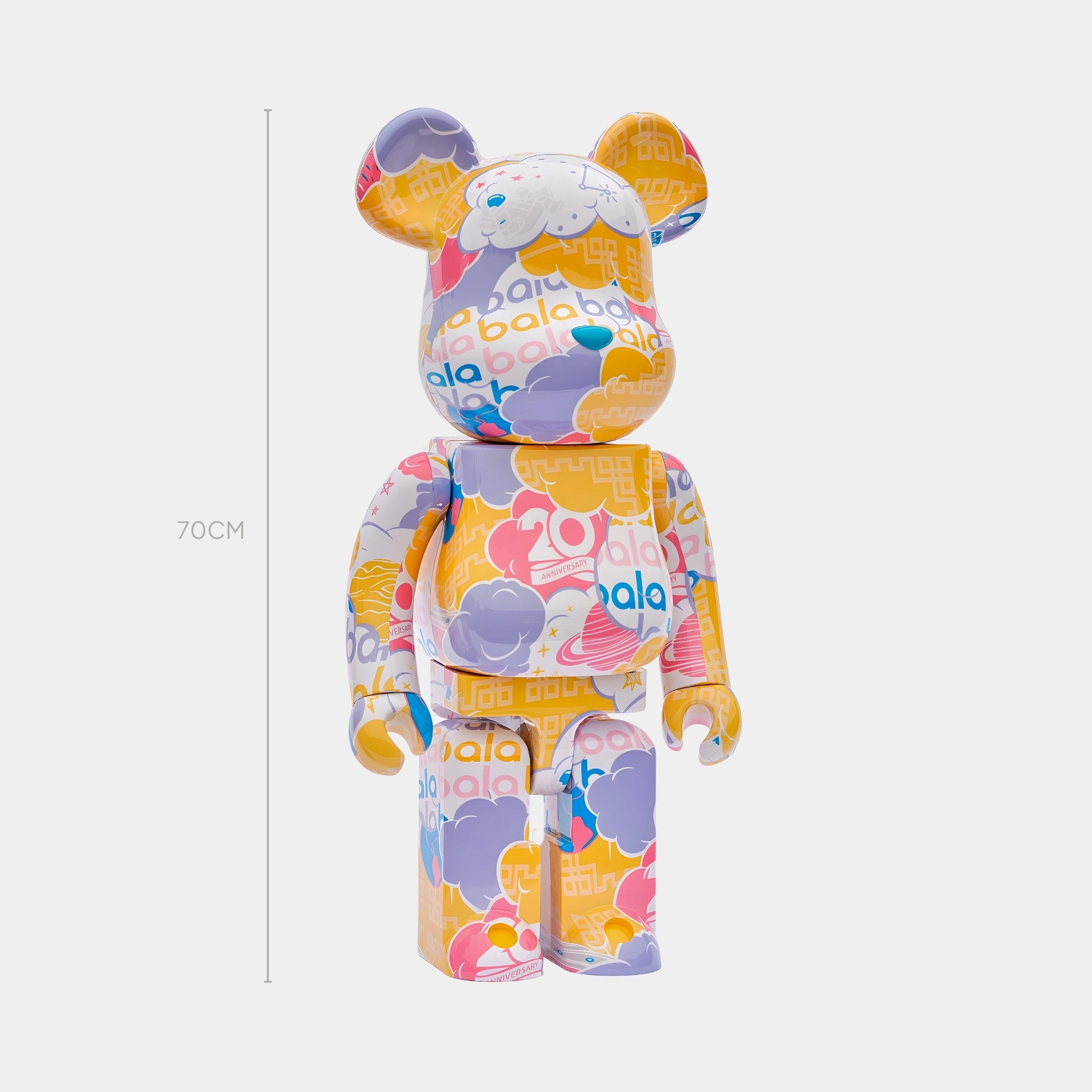 The Anniversary Cloud Bear Sculpture - 70cm by Giant Sculptures features pastel purple, yellow, pink, and white cloud-like shapes in a limited edition celebrating the theme with bala on a white background.