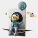 The Blue Balloon Astronaut 3D Portal Wall Art by Giant Sculptures features a cute astronaut with a gold helmet sitting on a floating surface, holding a teal balloon amid whimsical planets in a cosmic-themed background.