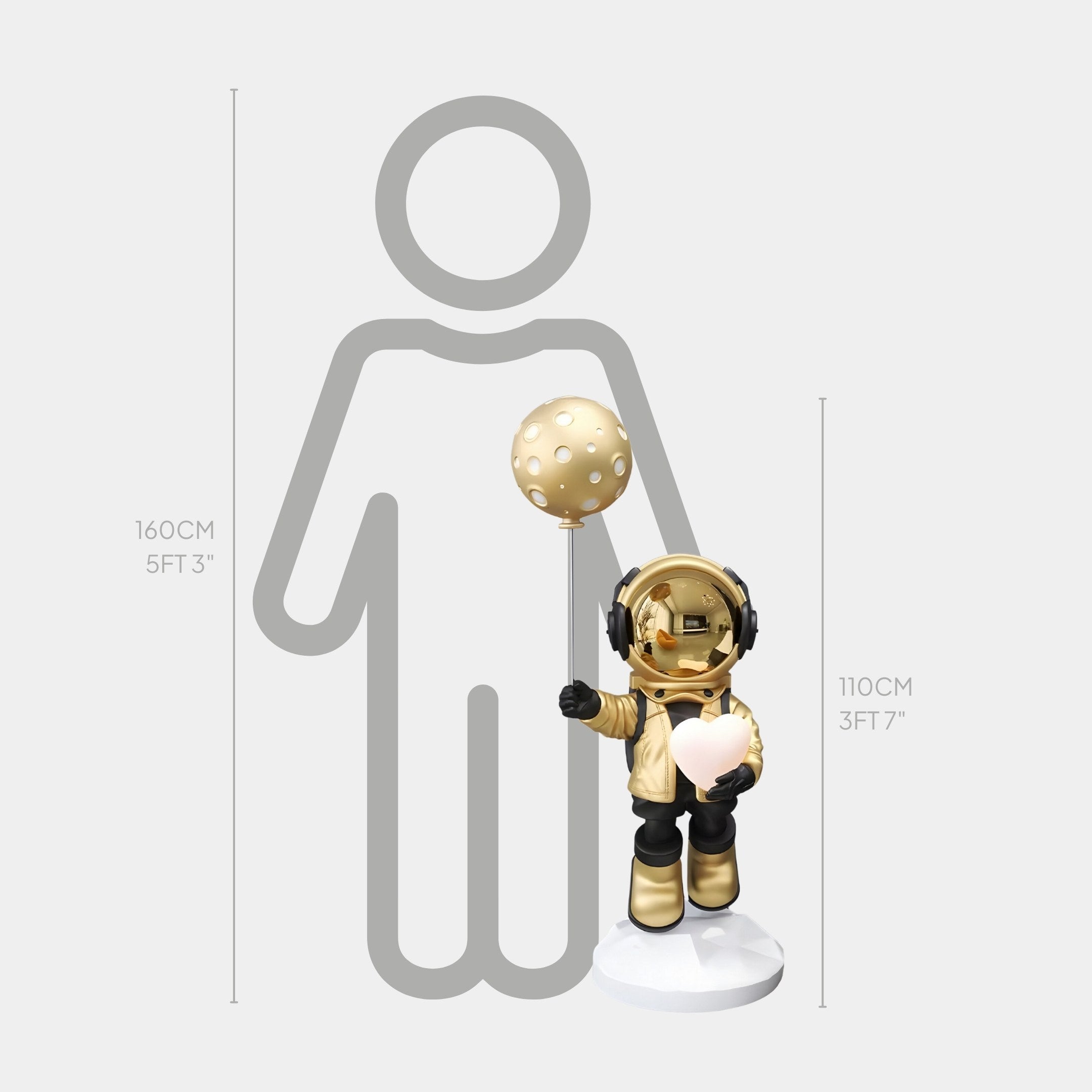 Beside a 160 cm human outline stands the Celestial Gold Astronaut Glow Heart Balloon Sculpture - 110cm by Giant Sculptures, a gold figure holding a heart balloon and lollipop, glowing like an interior lamp with measurements in centimeters and feet displayed.