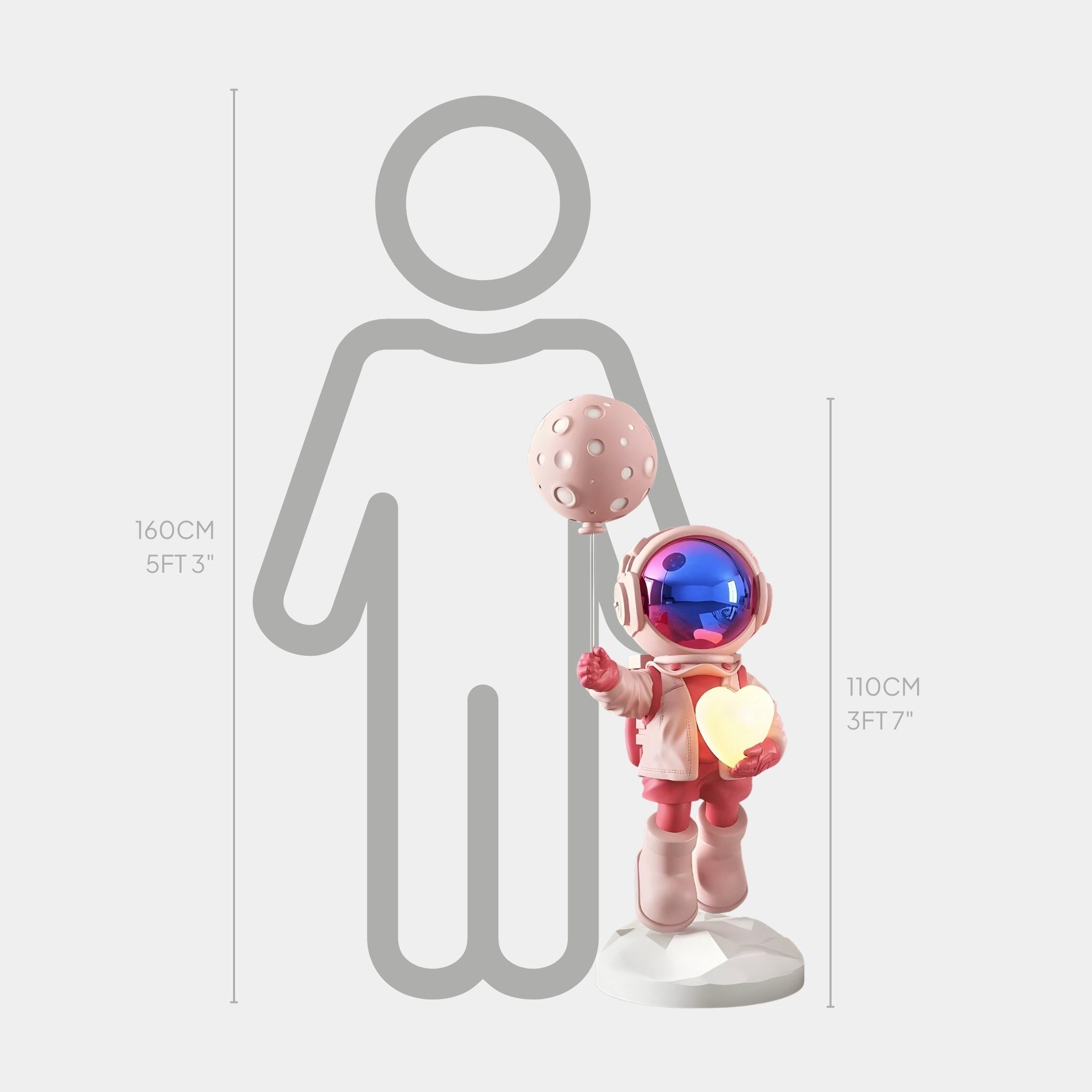 The 110 cm Stellar Pink Astronaut Glow Heart Balloon Sculpture by Giant Sculptures stands with its reflective helmet alongside a 160 cm human outline, adding a Cosmic Touch to the scene.