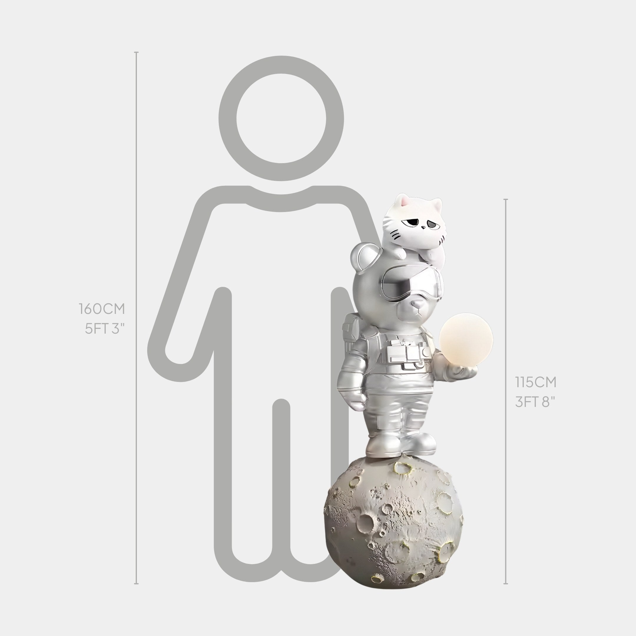 The Chrome Astronaut CosmoPals Glow Bear Sculpture by Giant Sculptures features a chrome astronaut in a spacesuit on a moon-like sphere holding a round light. Standing at 115 cm tall with an accompanying silhouette of 160 cm for scale, it embodies a futuristic aesthetic.