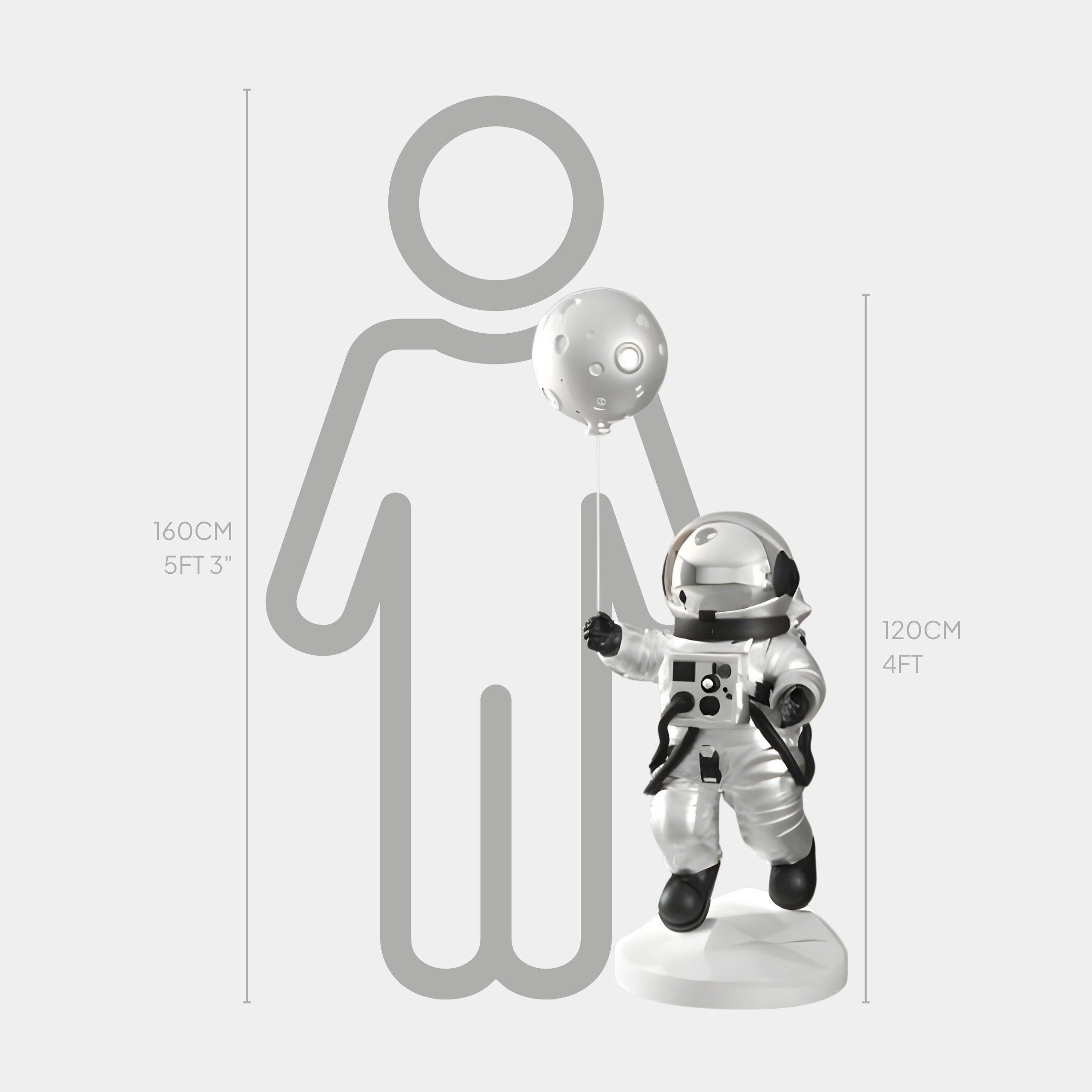 The Giant Sculptures Lunar Silver Astronaut Ranger Balloon Sculpture, 120 cm tall, features an astronaut with a moon-shaped balloon on a white base, embodying a space exploration aesthetic and standing proudly against a silhouette of someone 160 cm (5 ft 3 in) tall.