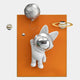 The Chrome 3D Astronaut Bunny Balloon Orange Wall Art by Giant Sculptures features a spacesuit-clad bunny floating above an orange rectangle, holding a moon balloon, with three stylized planets—including one with rings—around it.