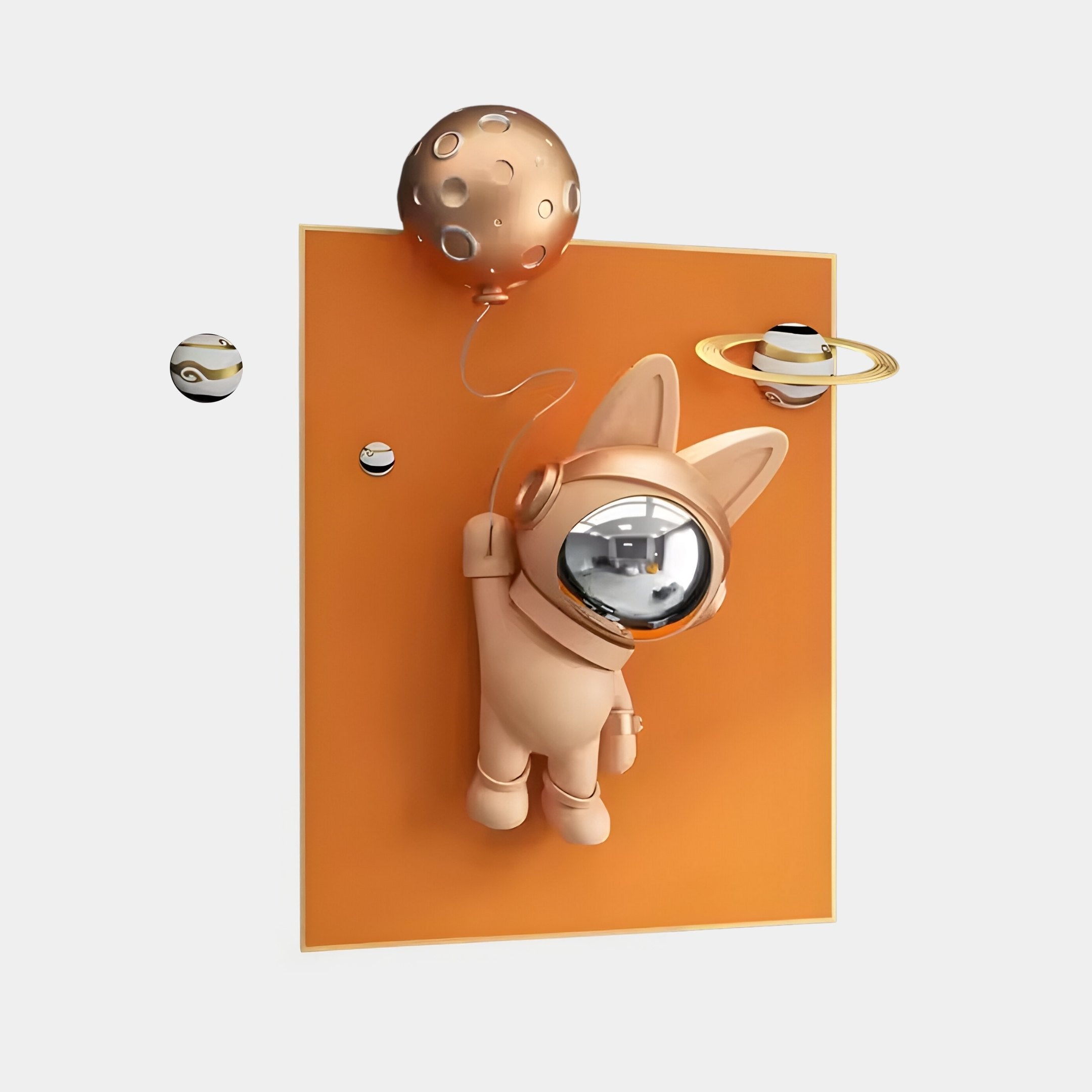 The Rose Gold 3D Astronaut Bunny Balloon Orange Wall Art by Giant Sculptures features a stylized astronaut bunny with a reflective helmet floating against an orange backdrop, holding a moon-shaped balloon, as small planetary models orbit nearby.