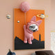 Giant Sculptures presents the Pink 3D Astronaut Bunny Balloon Lighthouse Wall Art, featuring a playful cosmic theme with a pink astronaut bunny and balloon on an orange backdrop, enriched by lighthouse and mountain silhouettes plus small planets.