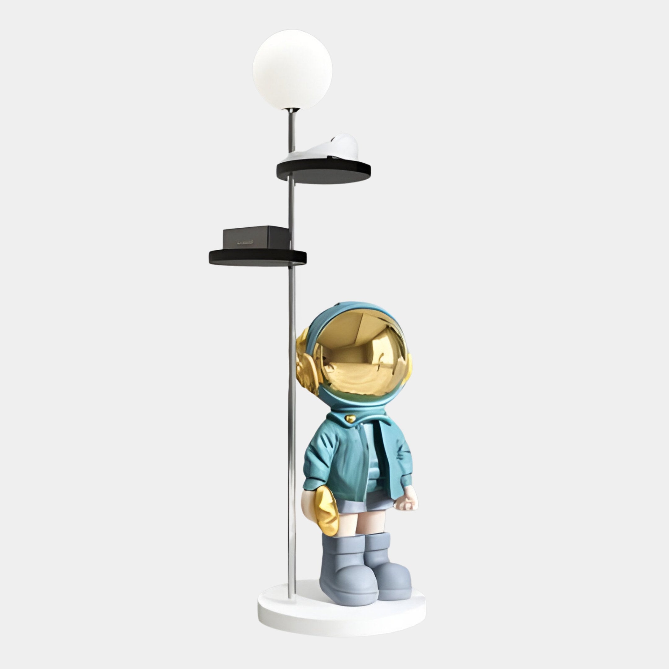 Introducing Giant Sculptures Blue Astronaut Beats Floor Lamp With Shelves - 135cm: a decorative teal centerpiece featuring a blue-suited astronaut with a golden visor and object, topped with a round light fixture on its circular base, perfectly blending functionality with cosmic charm.