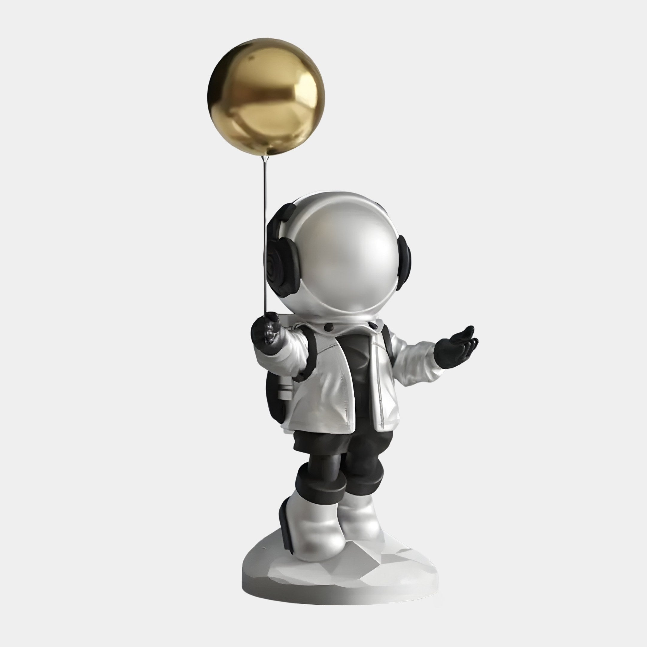 The Giant Sculptures Lunar Silver Astronaut Balloon Figure stands proudly at 42cm, featuring a small astronaut in a silver spacesuit with a reflective helmet, holding a golden balloon on a rounded base.