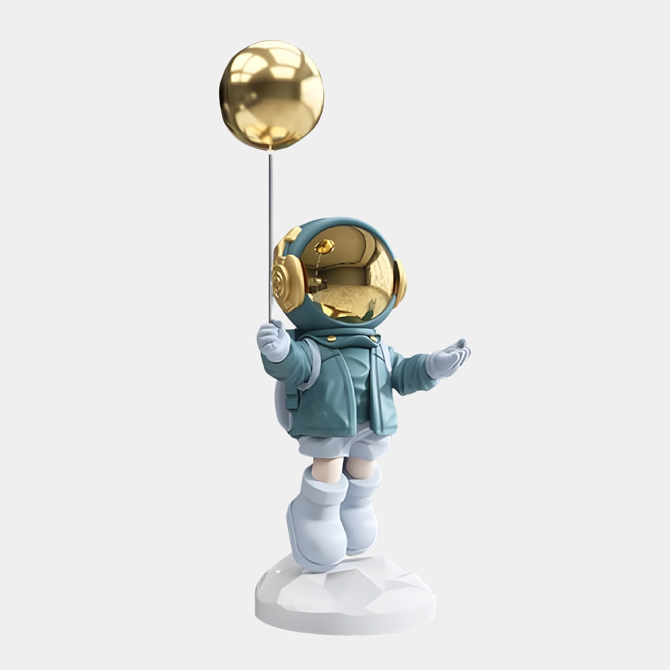 The Galactic Blue Astronaut Balloon Sculpture by Giant Sculptures features a resin astronaut in a teal spacesuit with boots, holding a golden balloon. Its reflective gold helmet shines atop a smooth white base, all against an understated backdrop.