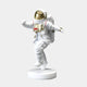 The White Space Astronaut Strider Sculpture by Giant Sculptures stands at 58cm, featuring a small astronaut with a white spacesuit and gold visor on one foot with raised arms. Mounted on a white base against a gray backdrop, its ideal for any collectors space-themed display.