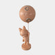 Rear view of the Rose Gold Astronaut Bunny Moon Balloon Sculpture by Giant Sculptures, showing the helmeted bunny holding a cratered moon balloon on a plain background.
