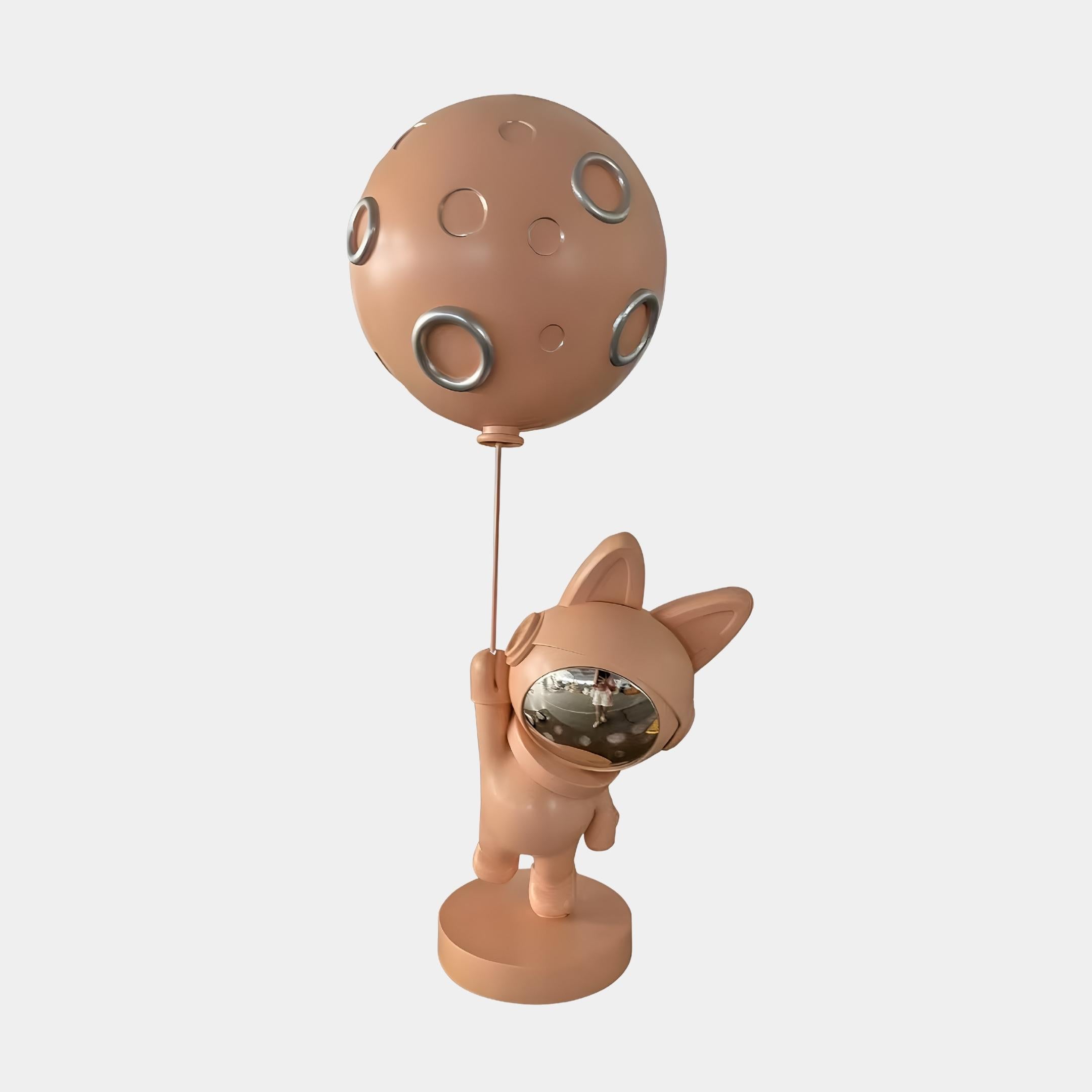 Rose Gold Astronaut Bunny Moon Balloon Sculpture by Giant Sculptures, 60cm resin figure in metallic rose gold holding a cratered moon balloon, on a plain background.