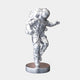 The Cosmic Chrome Space Astronaut Explorer Sculpture by Giant Sculptures, standing 63cm tall, embodies futuristic indoor accents. This reflective chrome statue depicts an astronaut in a spacesuit with a helmet and backpack, walking on a round base against a simple white background.