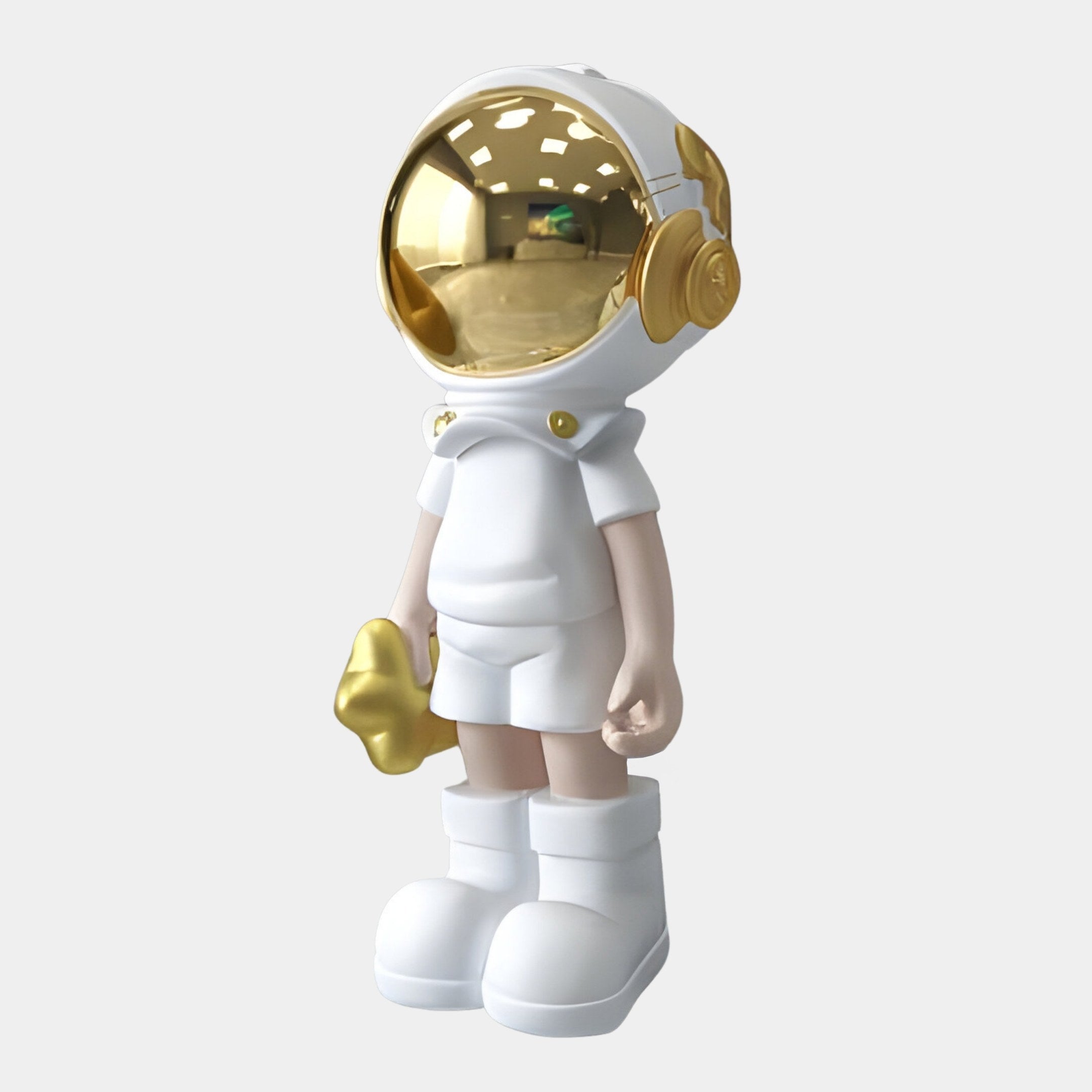 The Cosmic White Astronaut Buddy Sculpture - 70cm by Giant Sculptures presents a smooth, minimalist design with a stylized figure featuring a gold visor and accents, holding a small gold object. Its ideal for futuristic décor.