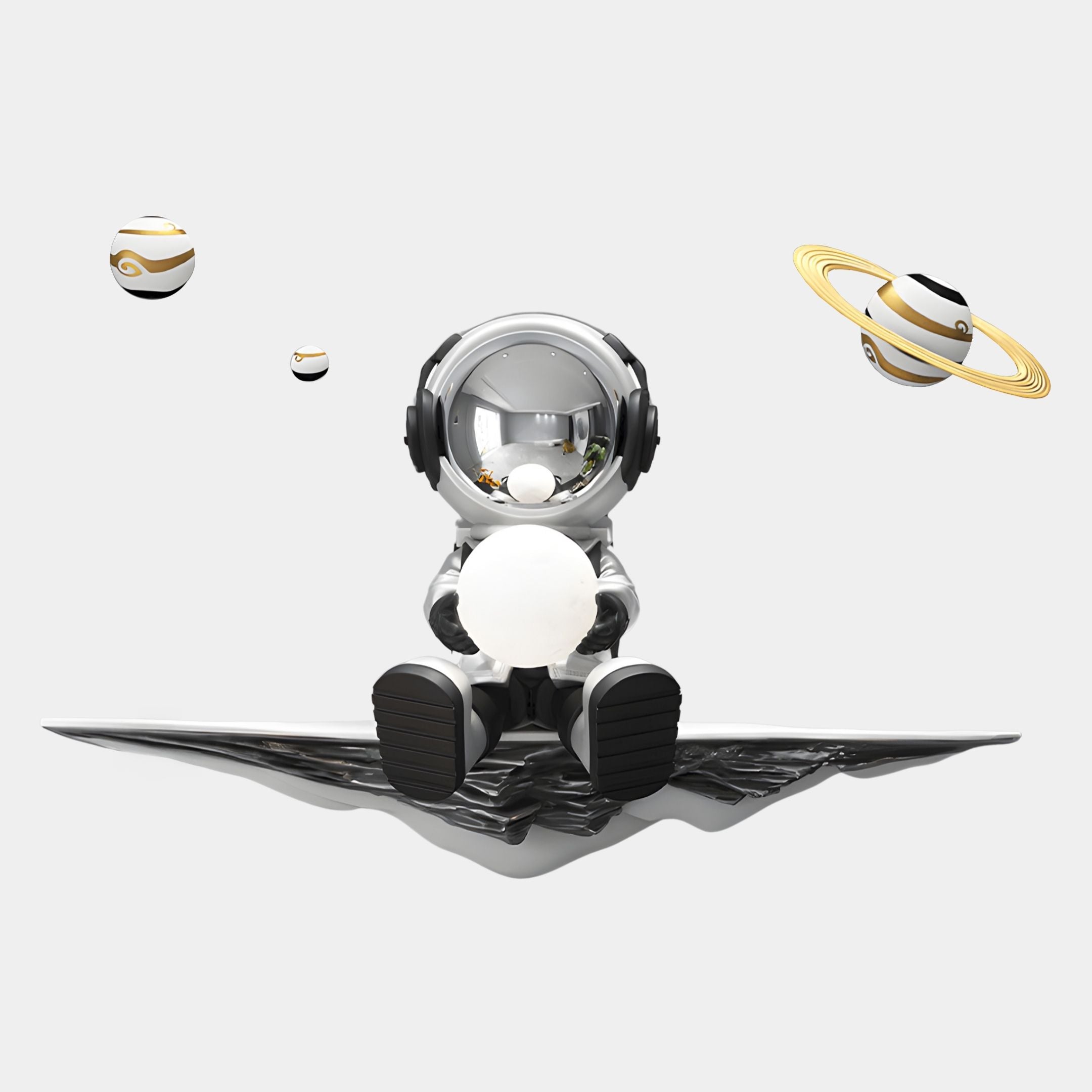 The Silver 3D Dreamer Glow Astronaut Wall Art by Giant Sculptures features a shiny astronaut on a metallic platform with a glowing white orb, plus three stylized planets in the background—ideal for modern decor.