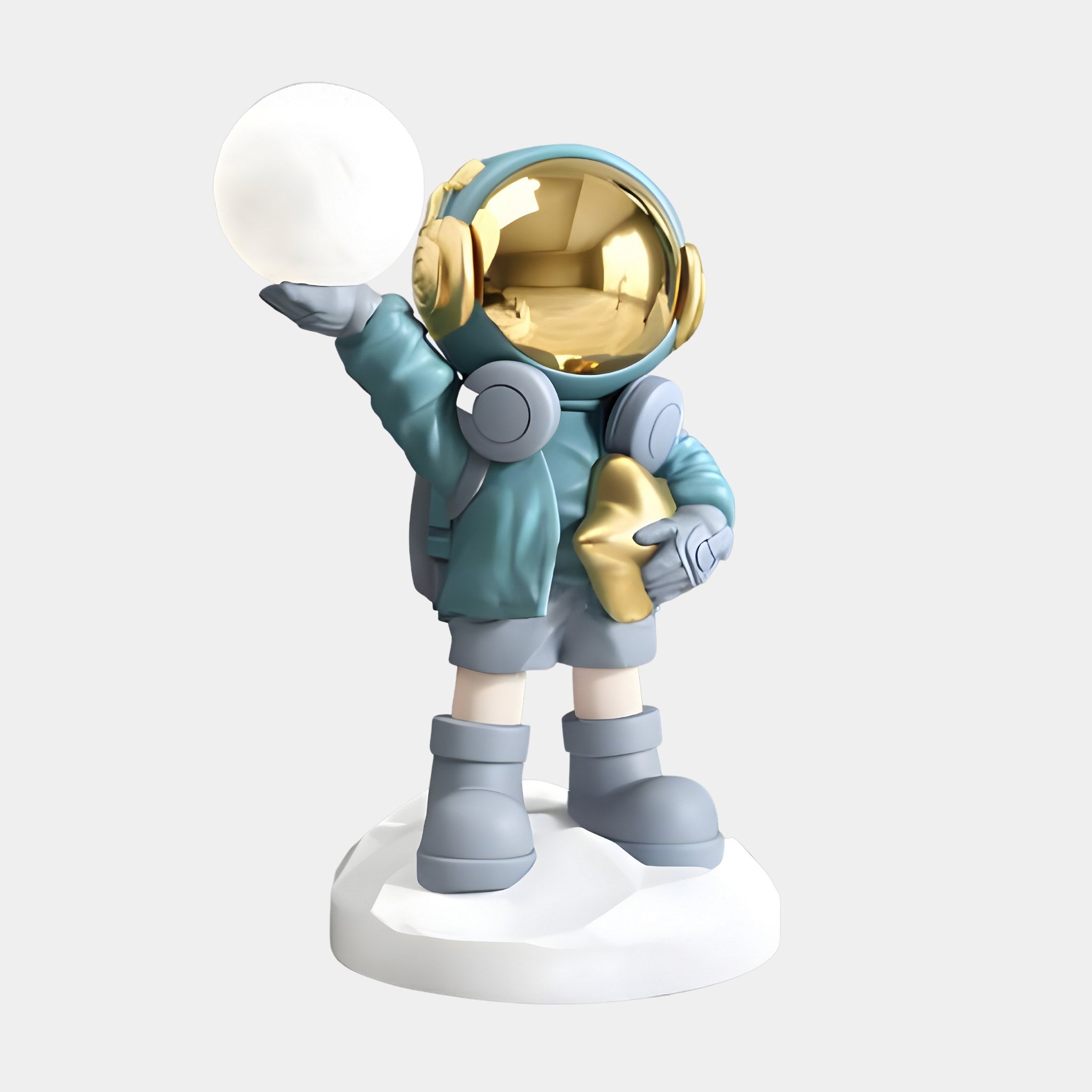 Meet the Galactic Blue Astronaut Beats Glow Orb Sculpture by Giant Sculptures. Standing 75cm tall, this space-themed décor features a shiny gold helmet, glowing orb in one hand, and a gold star in the other. Decked out in blue with oversized boots, it stands majestically on a white base.