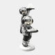 The Lunar Silver Astronaut Duo Server Sculpture by Giant Sculptures is a 78cm modern tray featuring two astronauts—one with a book and serving tray, another above holding a glowing sphere—on a white rocky base.