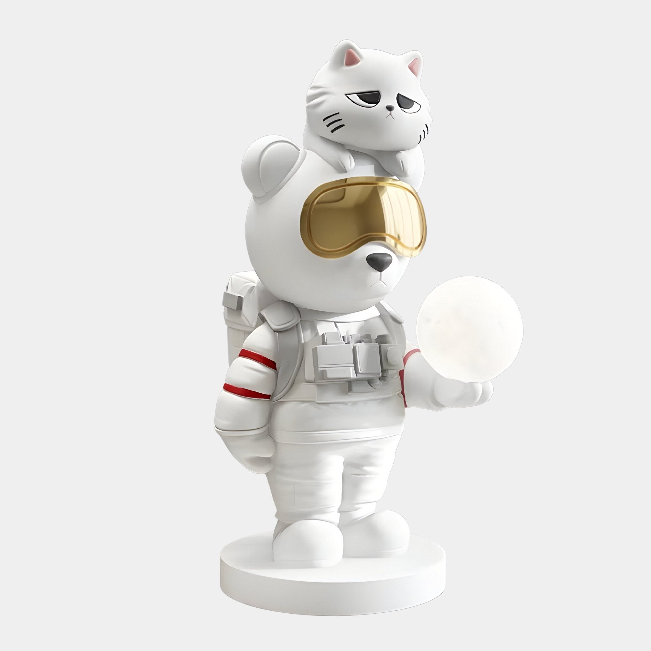 The 80cm White Astronaut CosmoPals Glow Bear Sculpture by Giant Sculptures features a bear in a white astronaut suit with a gold visor, standing on a round base and topped with a grumpy cat. A glowing sphere against the plain white backdrop radiates whimsical illumination.