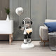 The Lunar Silver Astronaut Glow Heart Balloon Sculpture by Giant Sculptures features a battery-powered glow heart, standing on a white base. Adorned with headphones and a reflective helmet, it complements any modern room with a white cabinet, plant, and gray sofa. Height: 110cm.