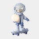 The Cosmic Sky Skater Astronaut Glow Sculpture (80cm) by Giant Sculptures features a reflective-helmet astronaut atop a skateboard with a glowing orb, offering striking contemporary décor in light blue and white.