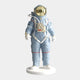 The Celestial Blue Space Astronaut Standing Sculpture (88cm) by Giant Sculptures features a gold visor, red accents, and detailed tubes. Set on a white base, it’s perfect for adding a modern touch to interiors.