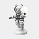 The Astral Silver Astronaut Bear Glow Sculpture by Giant Sculptures is a 90cm metallic piece featuring a bear in a glossy silver spacesuit and helmet, standing mid-step on a round base while holding a glowing orb against a plain white background.