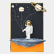 The White 3D Stellar Astronaut Planet Balloons Wall Art by Giant Sculptures features an astronaut with a gold visor on a floating gray rock, holding planet balloons against a dark starry sky—ideal for cosmic-themed décor.