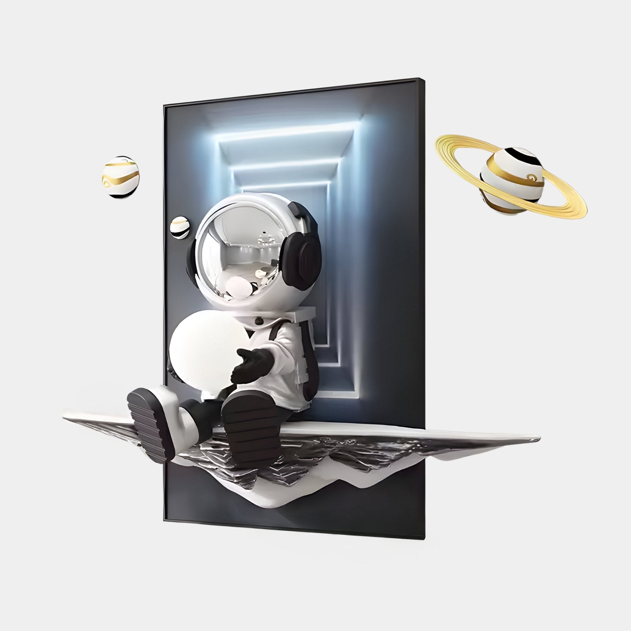 The Silver Astronaut Glow 3D Portal Wall Art by Giant Sculptures features a small silver astronaut figurine with headphones on a black-and-white platform. It protrudes from a doorway with a glowing tunnel and two Saturn-like planets, making it an enchanting piece of futuristic décor.