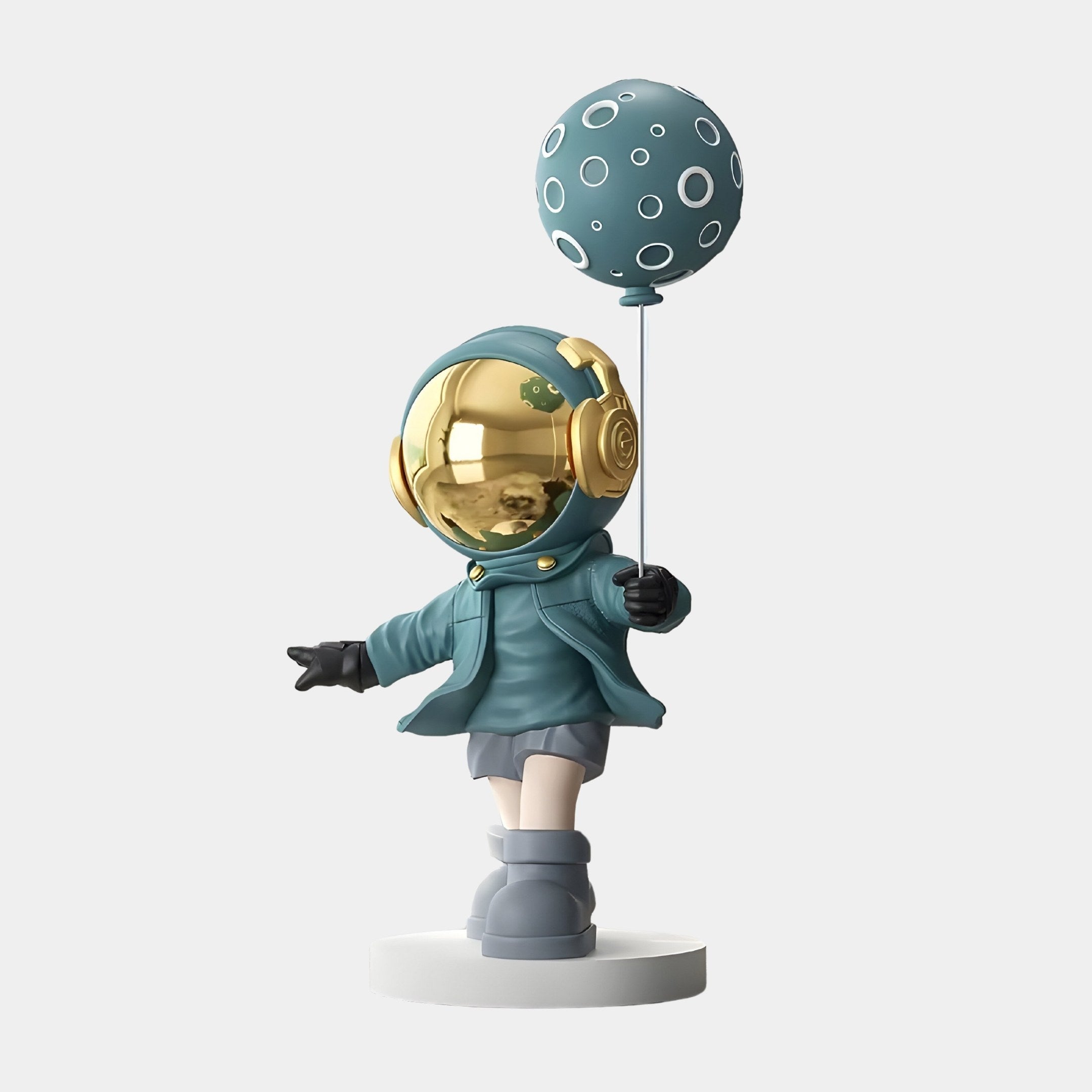 The Giant Sculptures Galactic Blue Astronaut Moon Balloon Sculpture is a whimsical toy figure in a teal jacket and boots with headphones, holding a polka-dotted moon balloon. It features a shiny gold helmet and stands proudly on a round base. Measures 96cm.