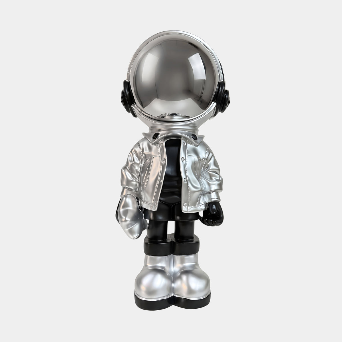 Lunar Silver Astronaut Beats Figure, 36cm resin sculpture with mirror-finish helmet, silver jacket, black headphones and boots, standing on a light grey base against a plain white background.