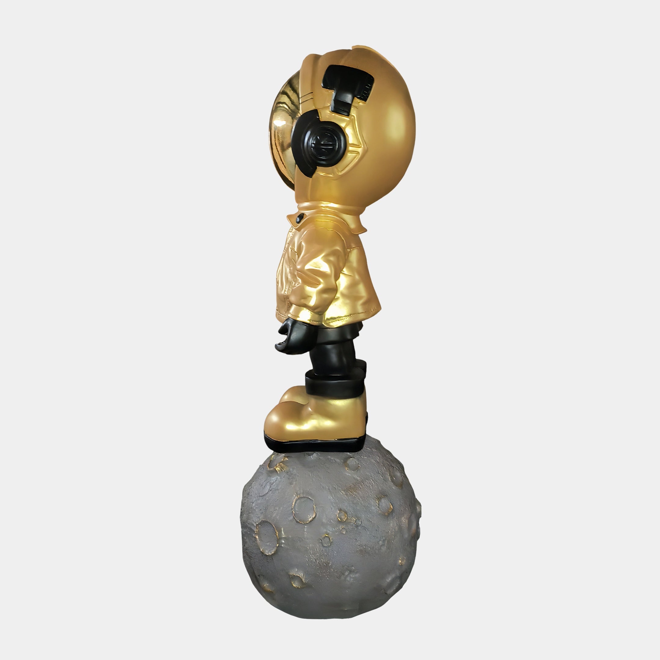 The Celestial Gold Astronaut Beats On Moon Sculpture (140cm) by Giant Sculptures is a playful Astronaut Decor piece, featuring a gold astronaut design perfect for adding celestial charm to any space.