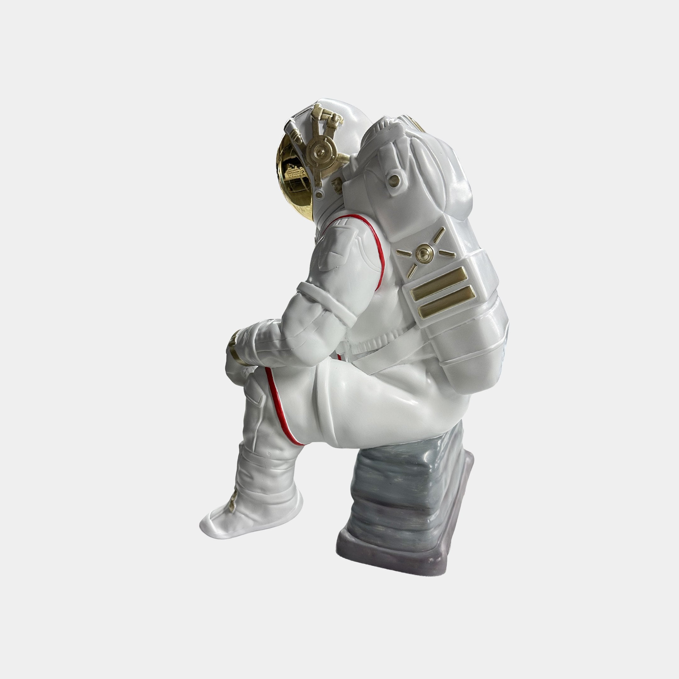 The Nova White Astronaut Thinker Figure by Giant Sculptures is a 43cm resin ornament with a gold-visored white suit, seated thoughtfully on a gray base—ideal cosmic home decor.