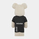 The Athlete Plush Bear Sculpture - 70cm by Giant Sculptures features a beige teddy bear mascot in a black outfit with F.C.R.B. on the back and CocaCola on the left leg, embodying true Sports Spirit against a plain white background.
